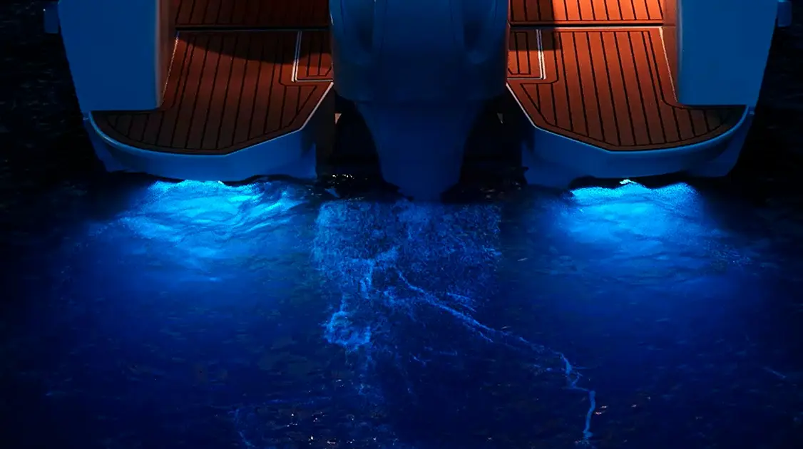 engines on a boat with a blue glow in the water after yacht maintenance services in Miami, FL