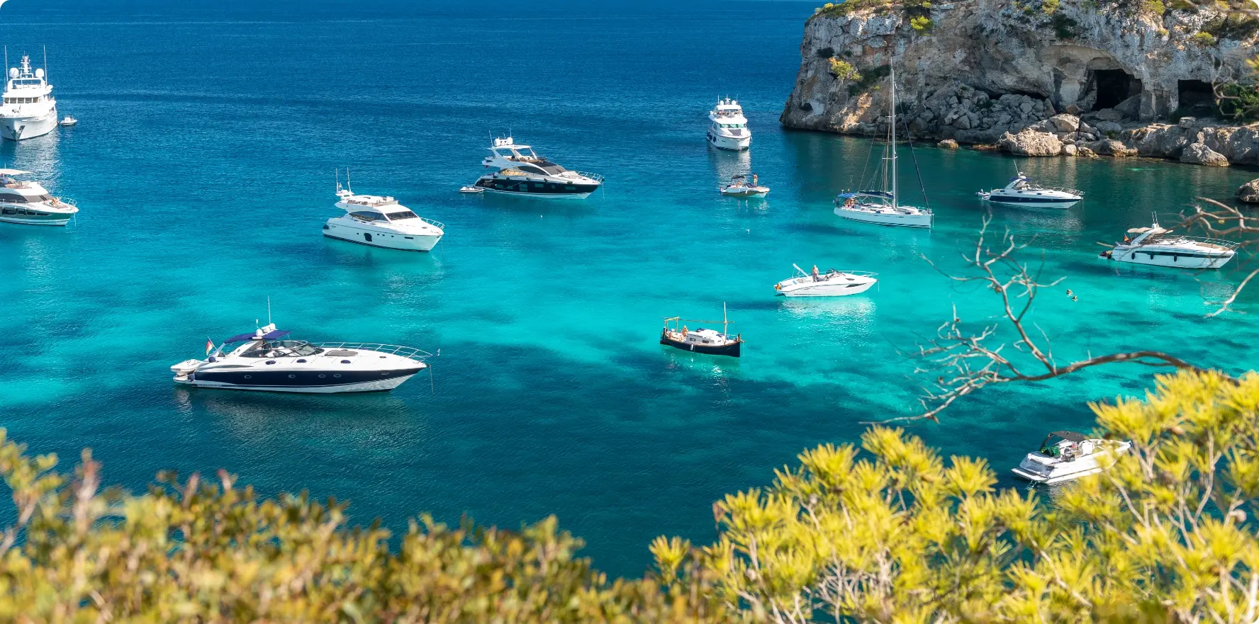 various boats and yachts on blue water